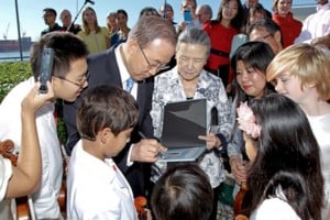 Pictured is UN Secretary-General Ban Ki-moon (centre), accompanied by his wife, Yoo Soon-taek (centre) signing an autograph for the young Tarumi Violinists who performed at the annual International Peace Bell ceremony (September 21). UN Photo/Paulo Figueiras)